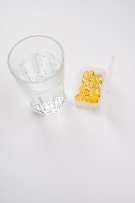 Glass of water and vitamins representing daily support and routine